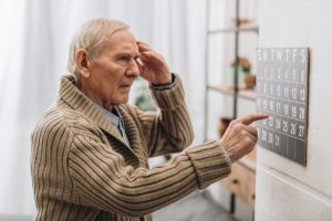 Man considering the early signs of dementia