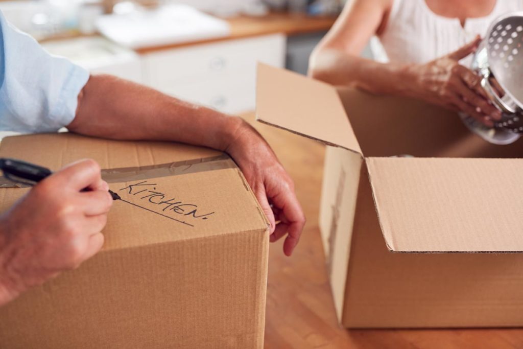 Hands of a person downsizing for retirement