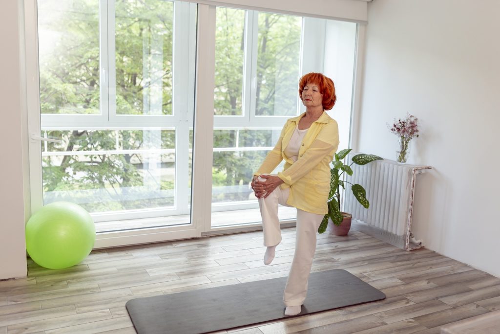 bigstock-Active-Senior-Woman-Doing-Yoga-373091689