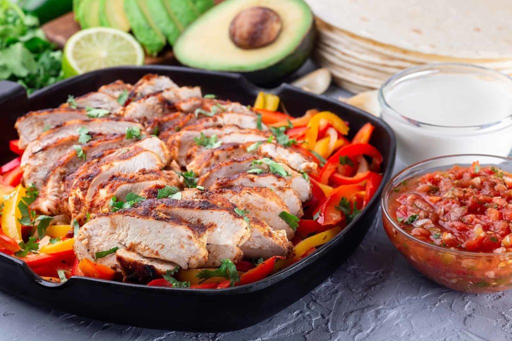 bigstock-Chicken-Fajitas-With-Bell-Pepp-429004157-1