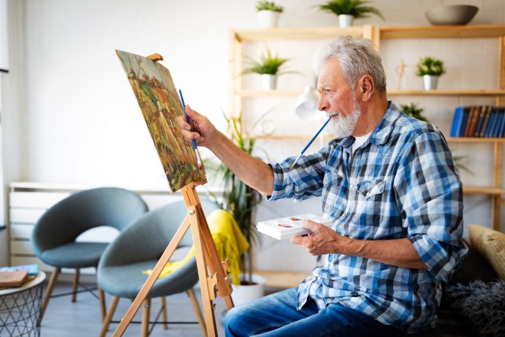 senior painting in independent living activities