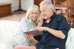 man and woman learn about the benefits of long-term care