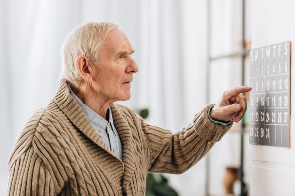man in sweater learning about memory loss causes