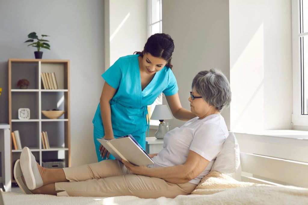 Person recovering from a stroke being helped by a caregiver