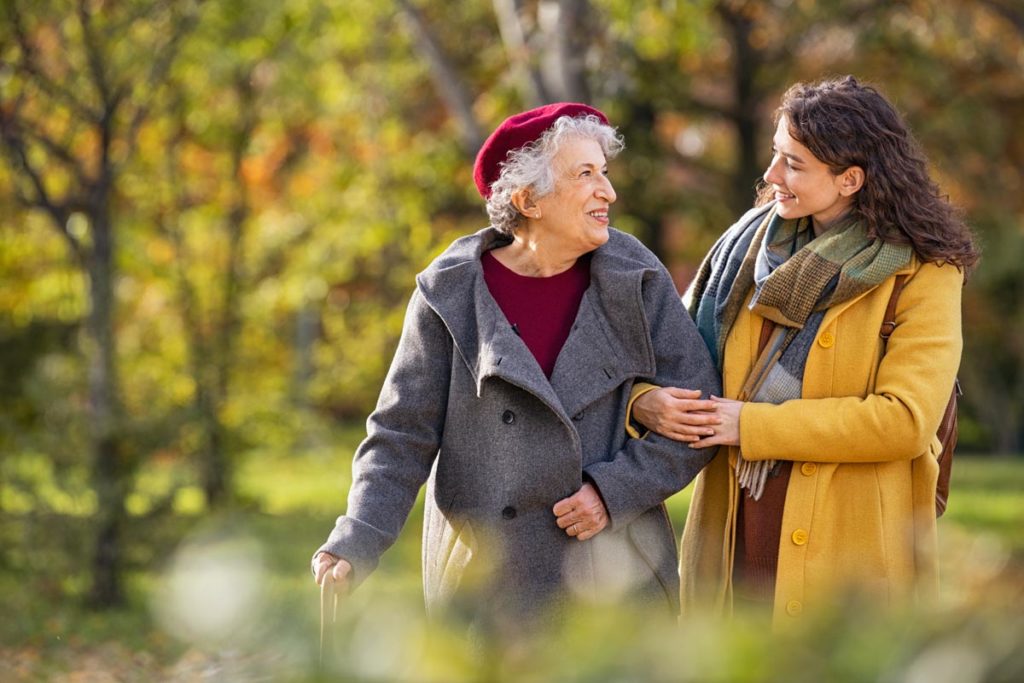 Two people talking about elderly recovery after a fall