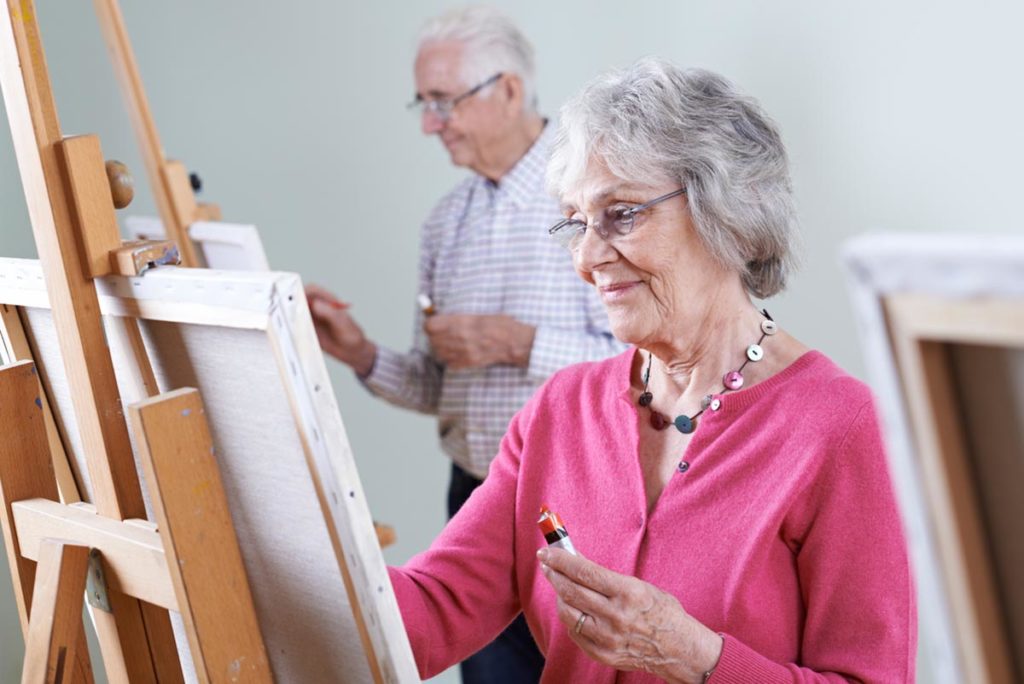 Two people painting, one of the popular hobbies for seniors