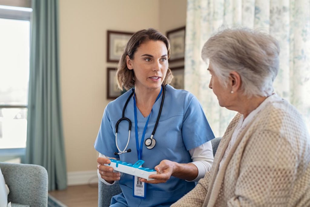 Person and nurse talking about medication management