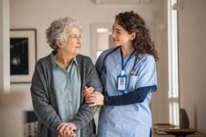 Older adult and nurse discussing skilled nursing vs. assisted living