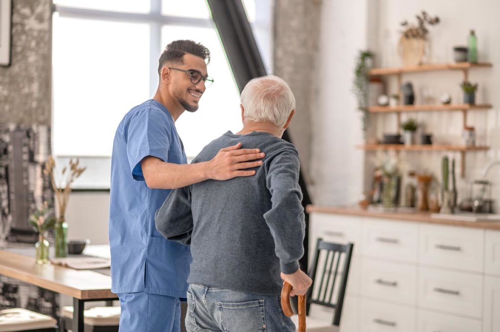 Medical professional and older adults talking about skilled nursing costs