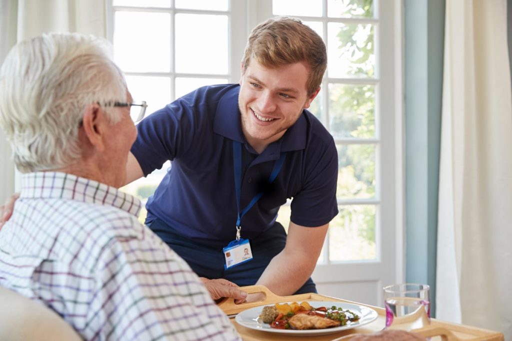 Medical professional speaking to a high-acuity patient