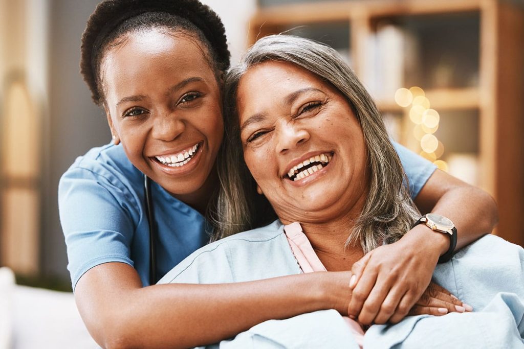 Nurse and older adult smiling while considering a skilled nursing facility vs. a nursing home