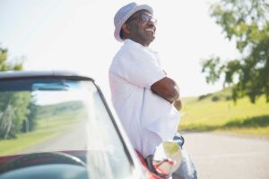 Older man outdoors enjoying fresh air and sunshine while participating in summer senior activities