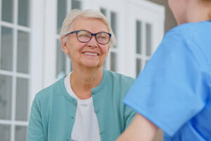 Happy senior woman in long-term care at a senior living center