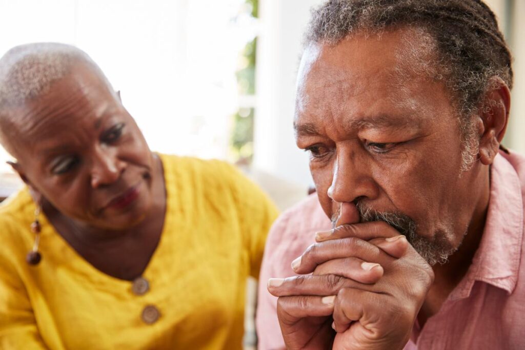 Concerned woman noticing signs of alzheimer's in her loved one