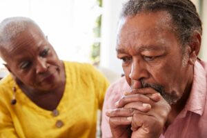 Concerned woman noticing signs of alzheimer's in her loved one