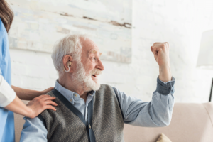 Older man becoming stronger and flexing his muscles after prioritizing diabetes prevention for seniors