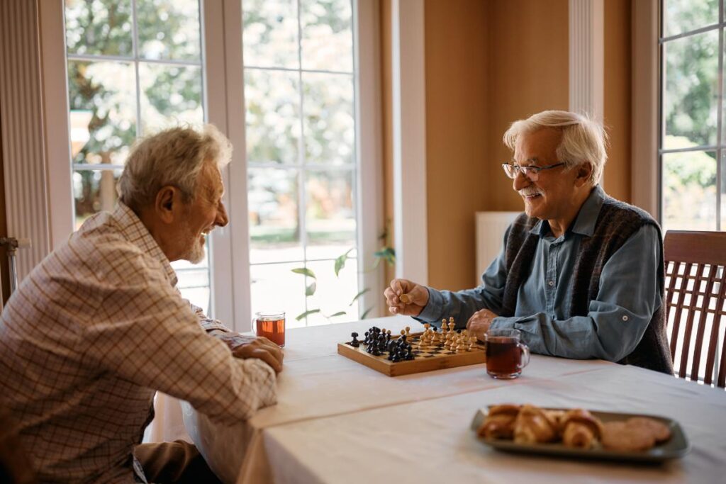 two seniors discussing independent living vs assisted living