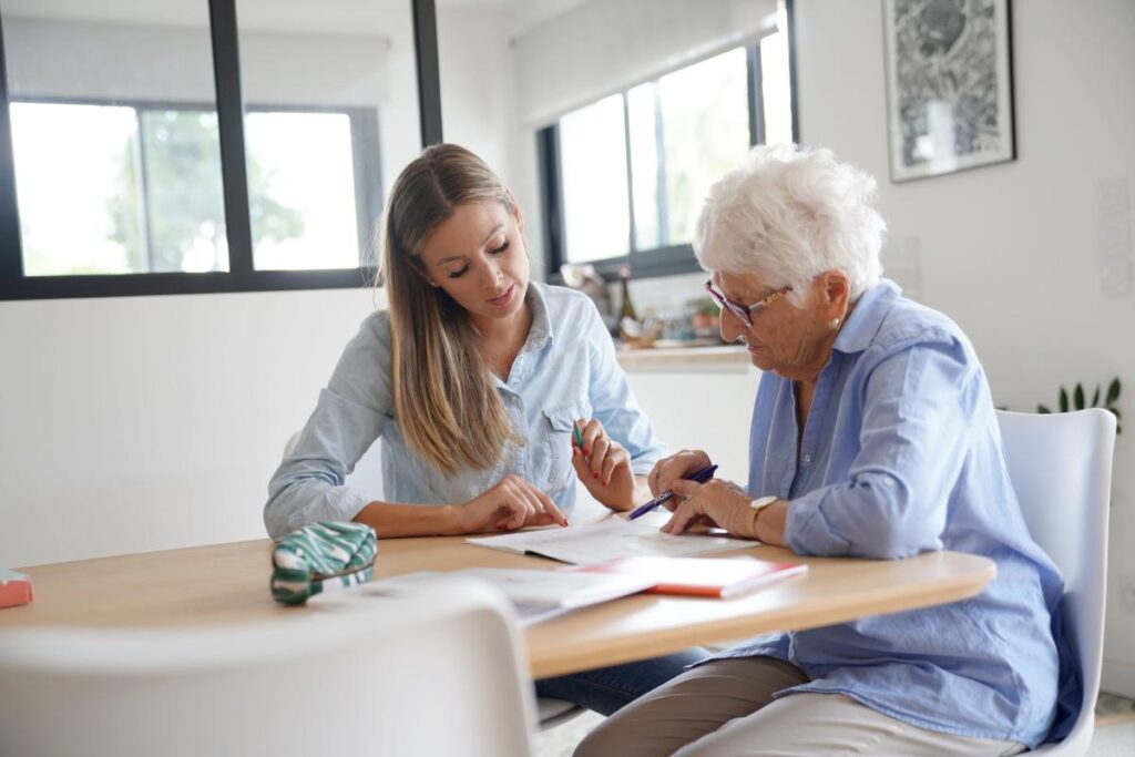 A senior asking a counselor about the average cost of assisted living