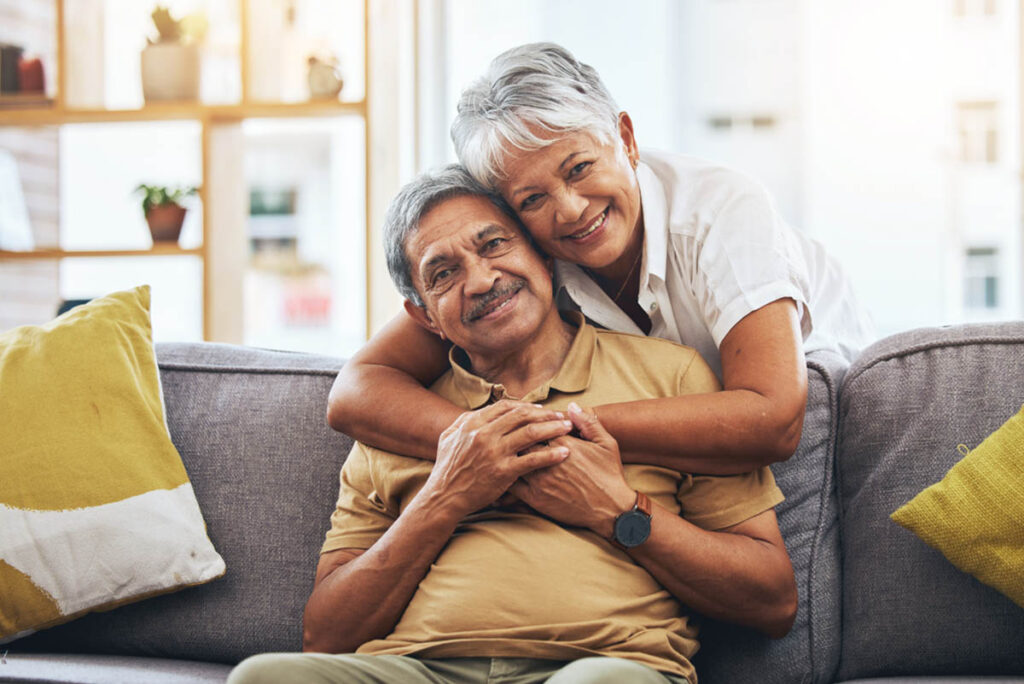 older couple smiling and embracing after learning answers to what is senior independent living