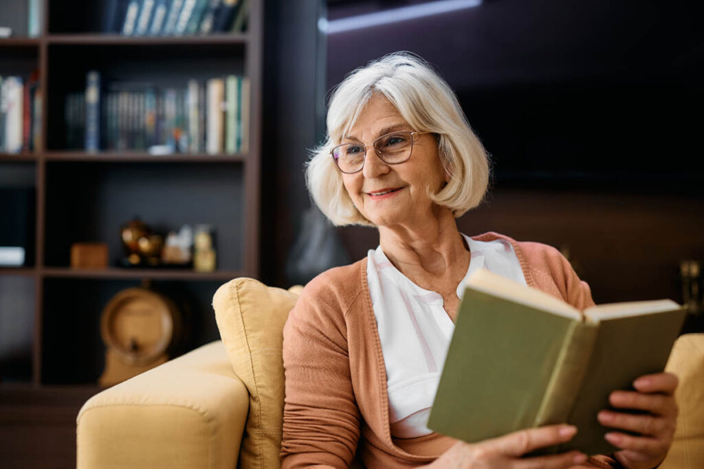 older woman reading about facts and myths of independent living