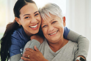 caregiver and senior posing for photo and smiling in dallas senior life care